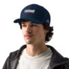 A man wearing a hat with oakland on it.