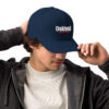 A man wearing a hat with oakland on it.